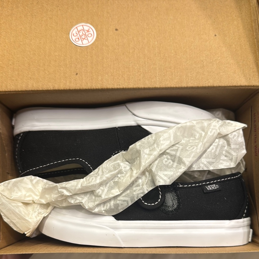 SOLD:Vans Classic Black and White Canvas Slip-Ons